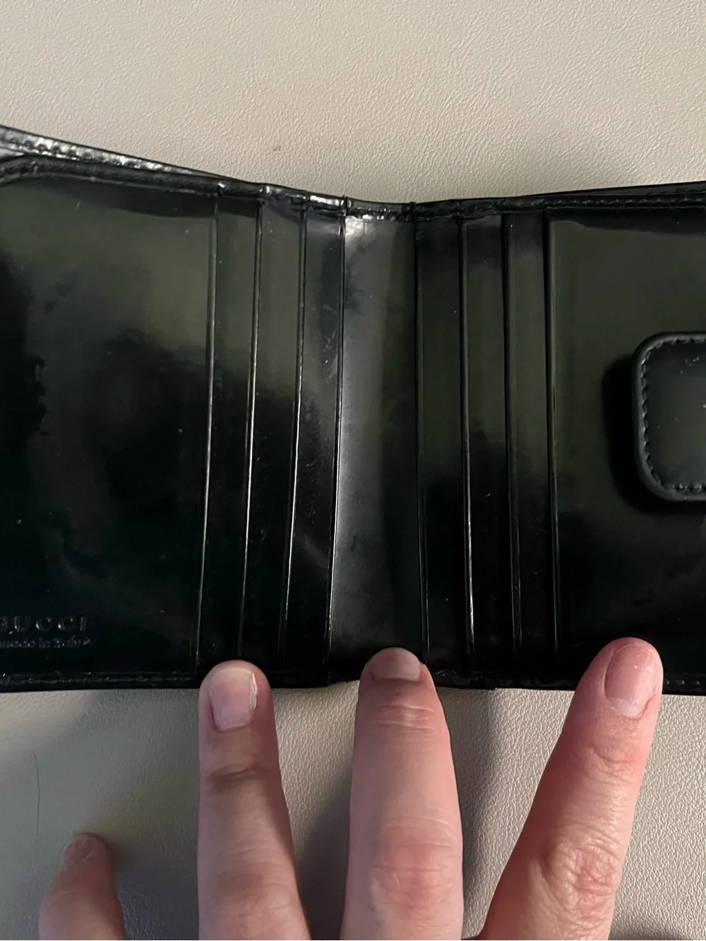 Gucci Black Patent Leather Bi-Fold Wallet with Embossed G